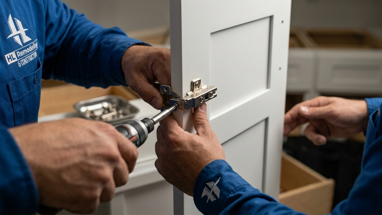 Technician installing soft close hinge hardware on kitchen cabinets Houston installation project Technician installing soft close hinge hardware on kitchen cabinets Houston installation project
